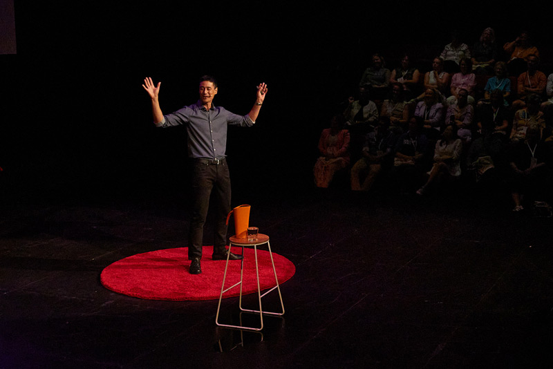 Daniel Sih on stage at TEDx Hobart 2023